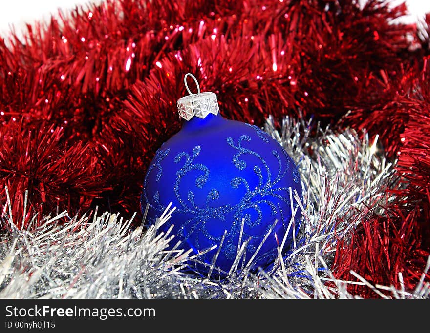 Blue christmas ball and silver tinsel