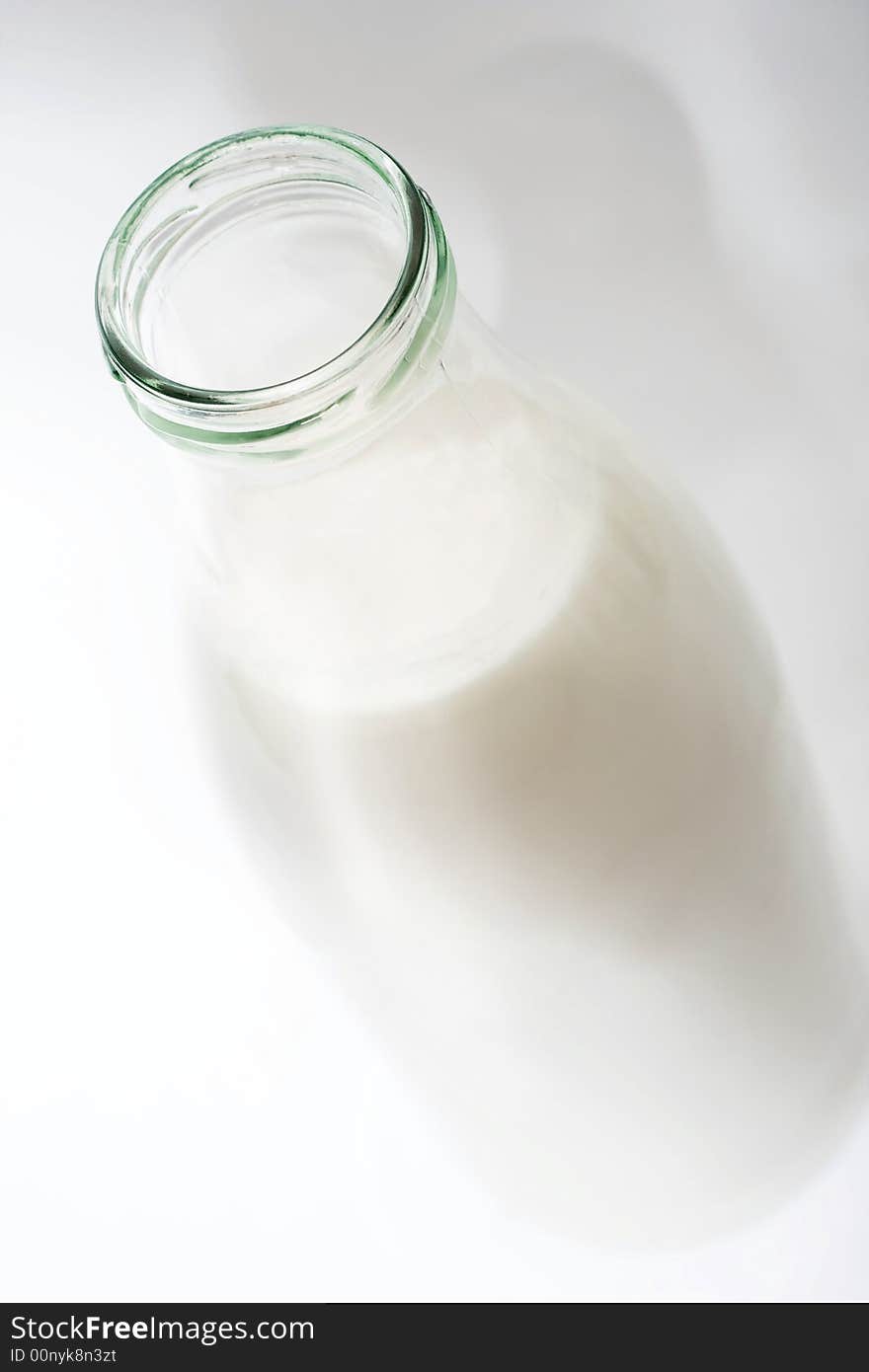 Milk in the glass bottle, low DOF, focus is on bottle neck