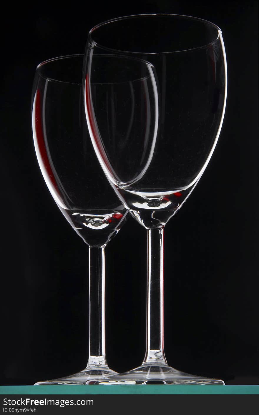 Two glasses on the black background