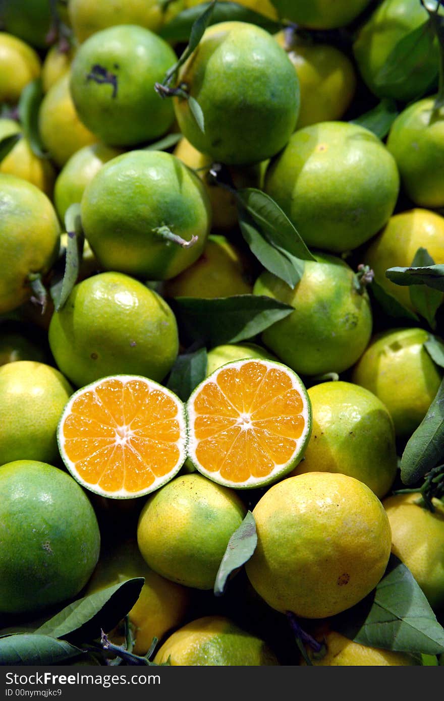 Fresh oranges with leaves