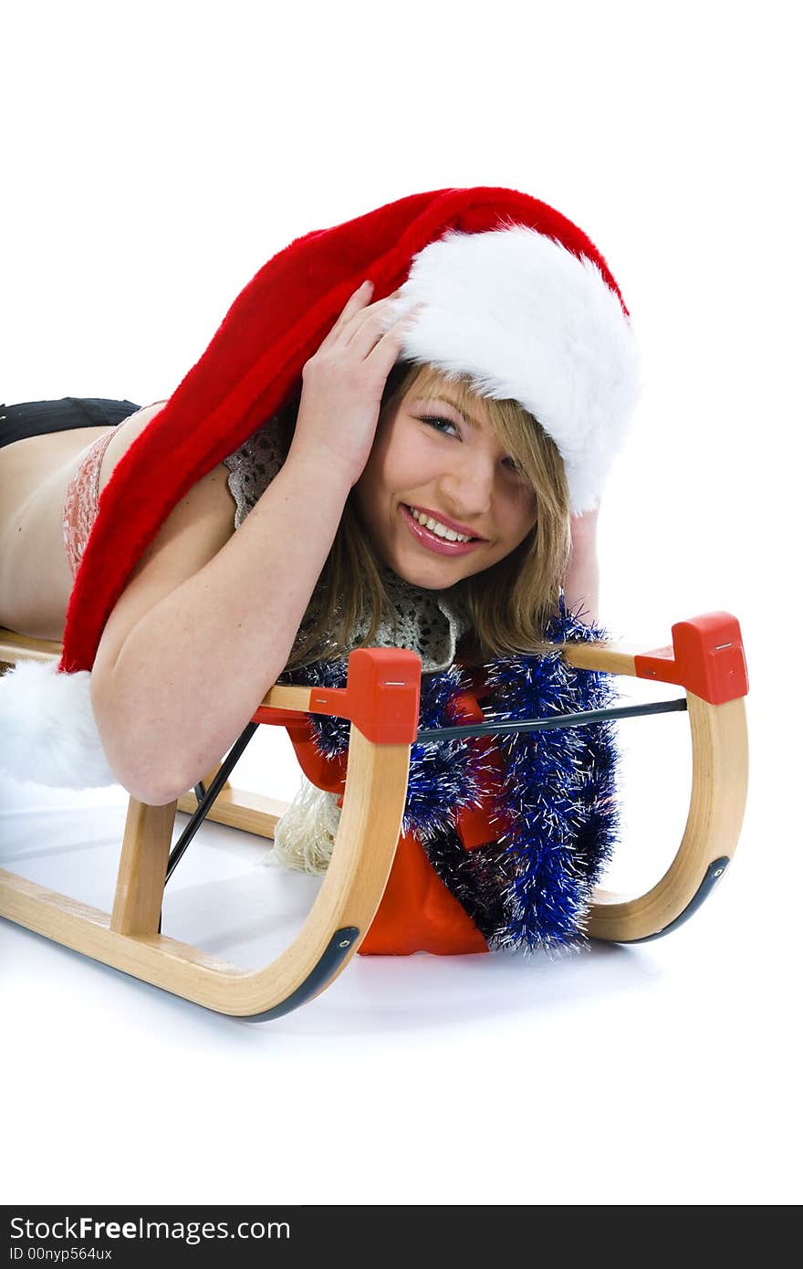 Beautiful  young woman on sledge on isolated background