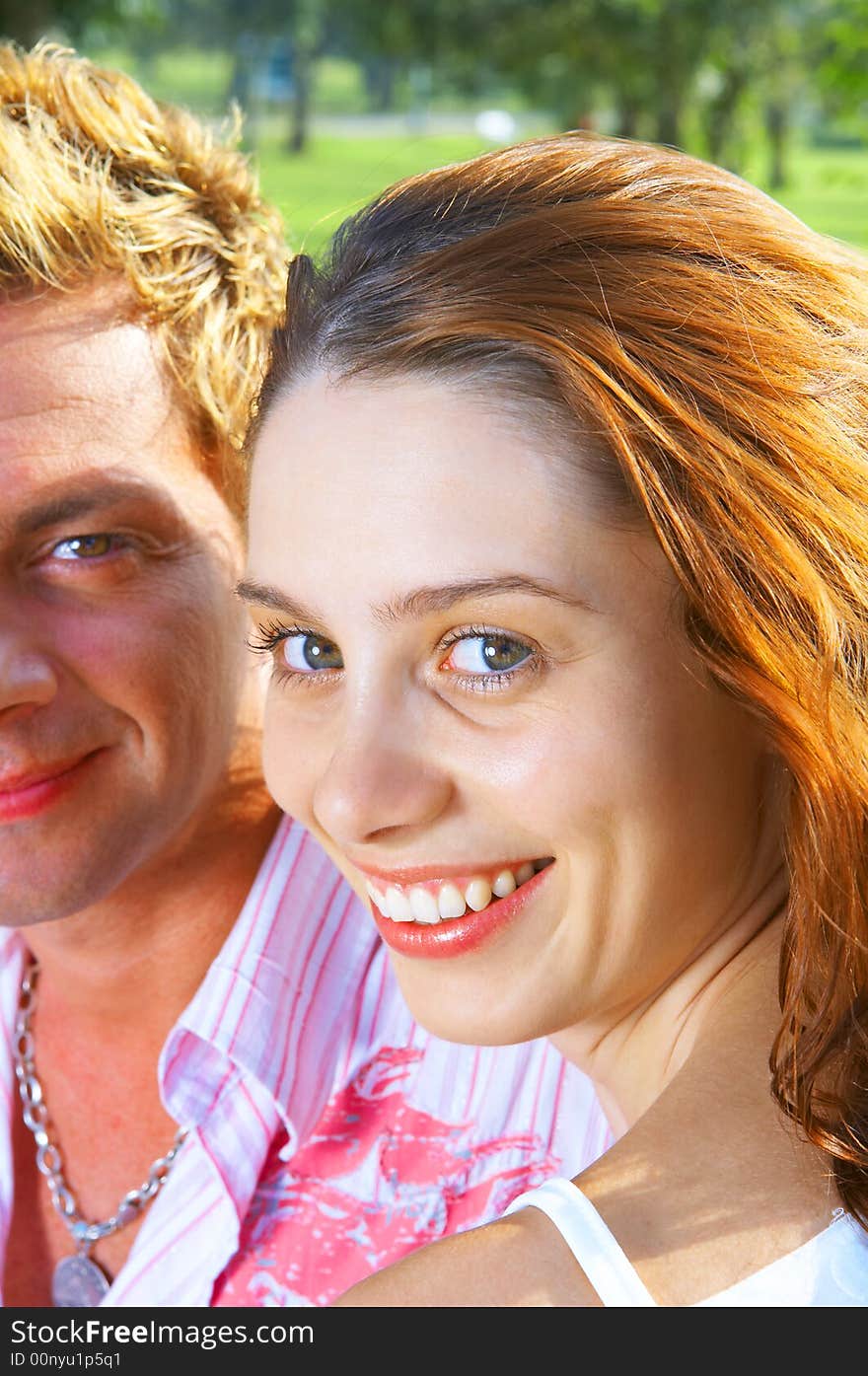 A portrait of attractive couple in summer environment. A portrait of attractive couple in summer environment