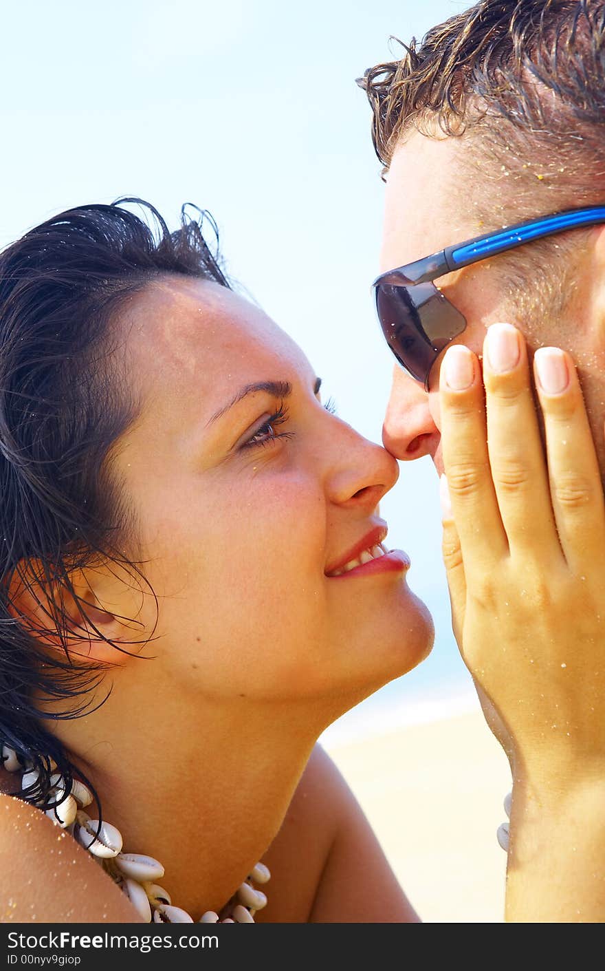 A portrait of attractive couple having fun on the beach. A portrait of attractive couple having fun on the beach