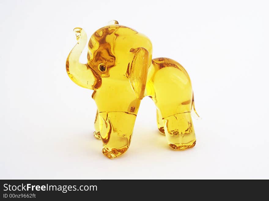 Figurine of yellow glass elephant.