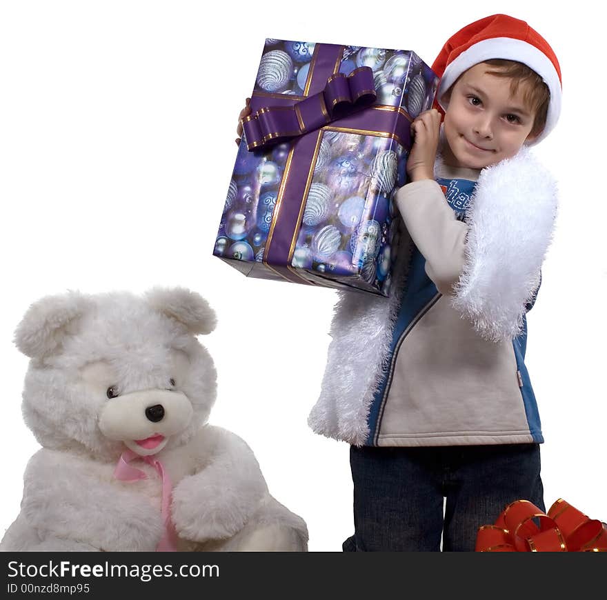 A celebratory card.
The boy in a cap santa with gifts and a bear on a white background. Isolated. Studio. A celebratory card.
The boy in a cap santa with gifts and a bear on a white background. Isolated. Studio.