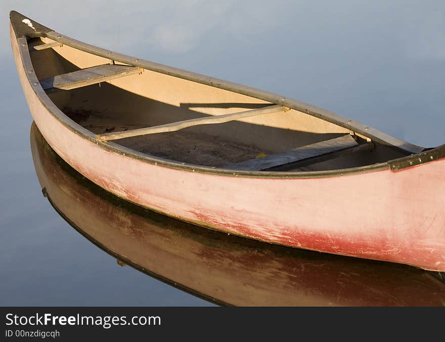 Pink canoe moored on Venice Canals, California