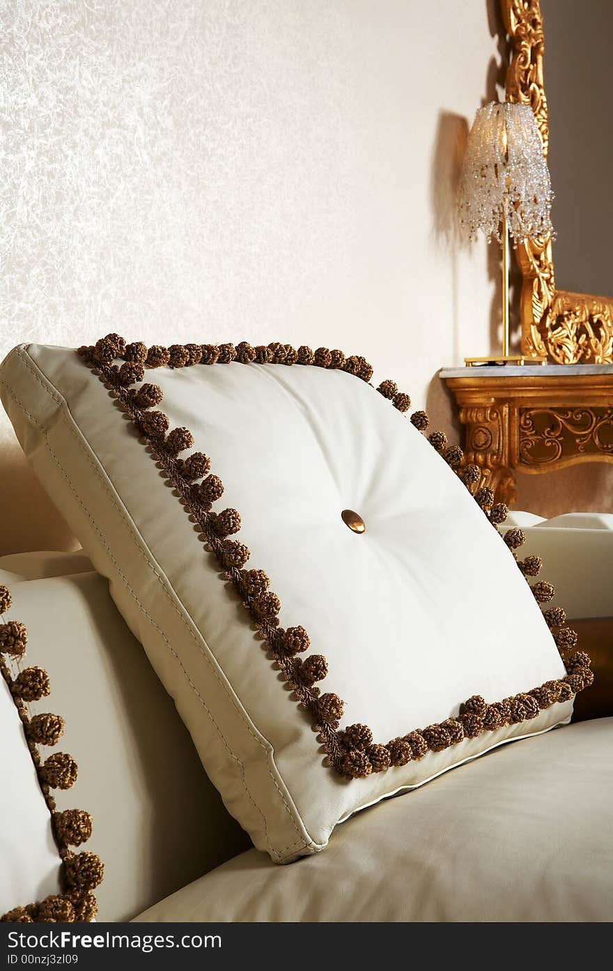 Beautiful pillow on the big white leather sofa