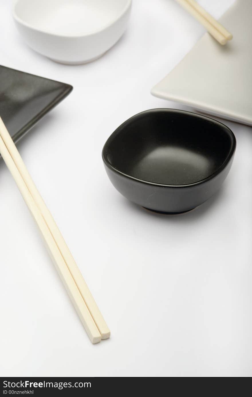 Sushi's plate and stick on a white background. Sushi's plate and stick on a white background