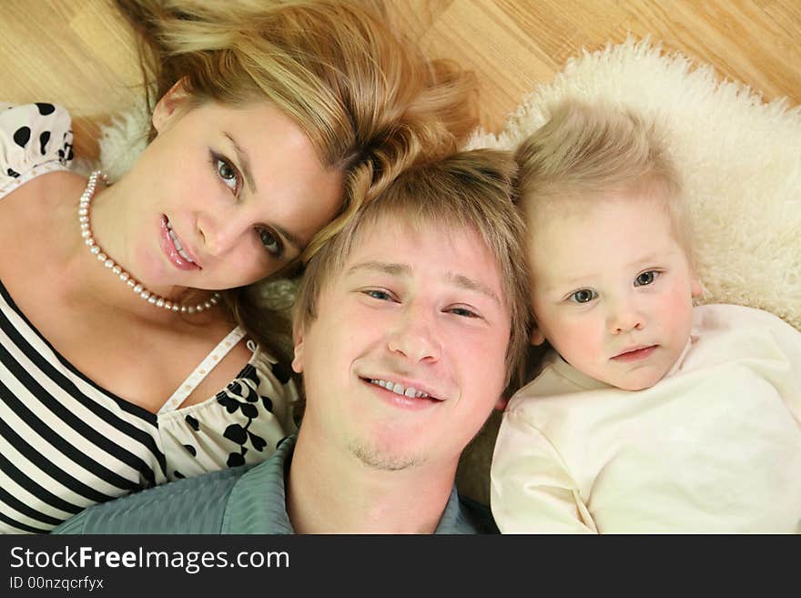 Family lie on floor