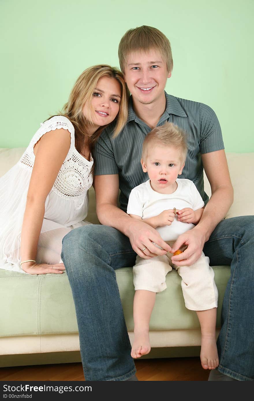 The family of three on sofa 2. The family of three on sofa 2