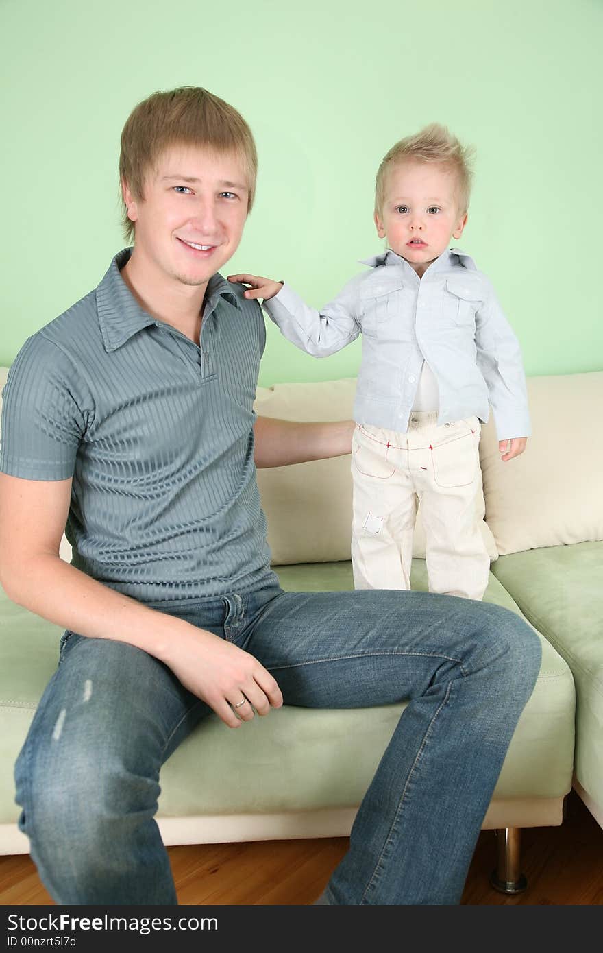 The father with the son on sofa. The father with the son on sofa