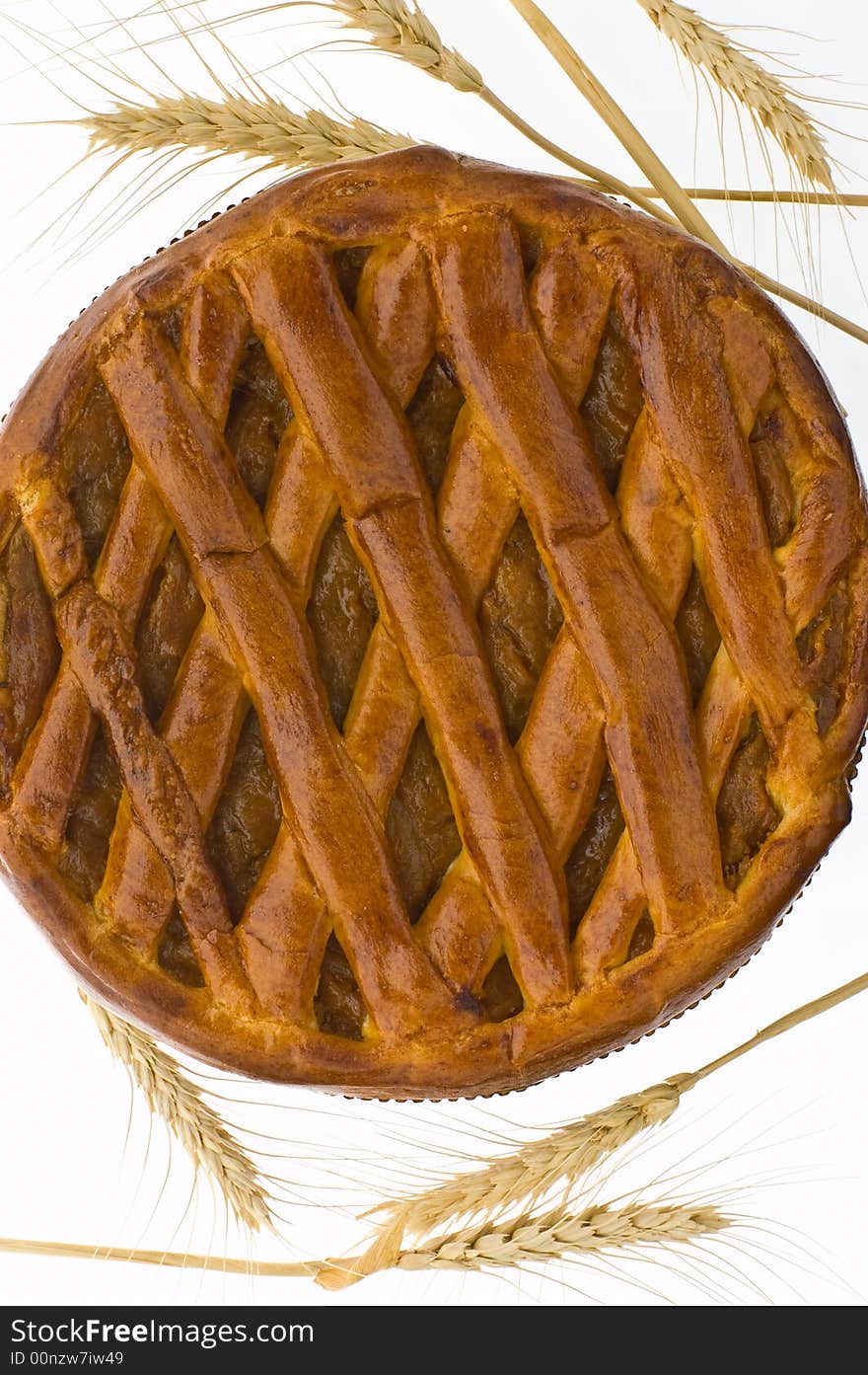 A pie with dried apricots and ears