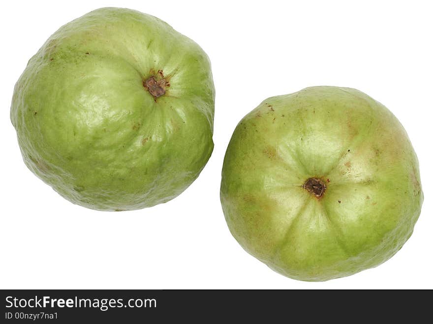 Two large, green stone seed guavas over white