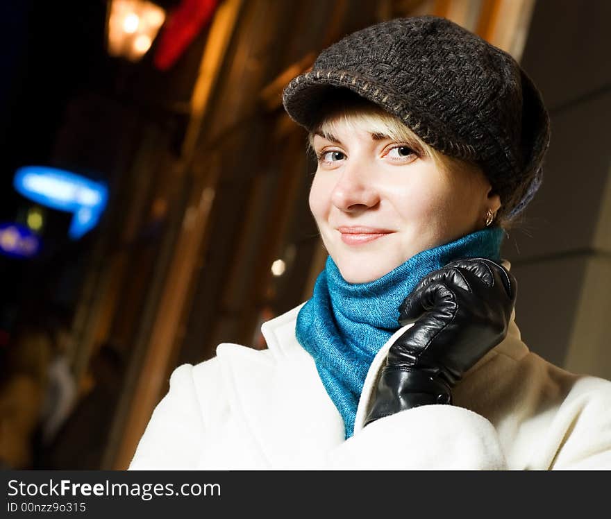 Beautiful girl in the city at night time