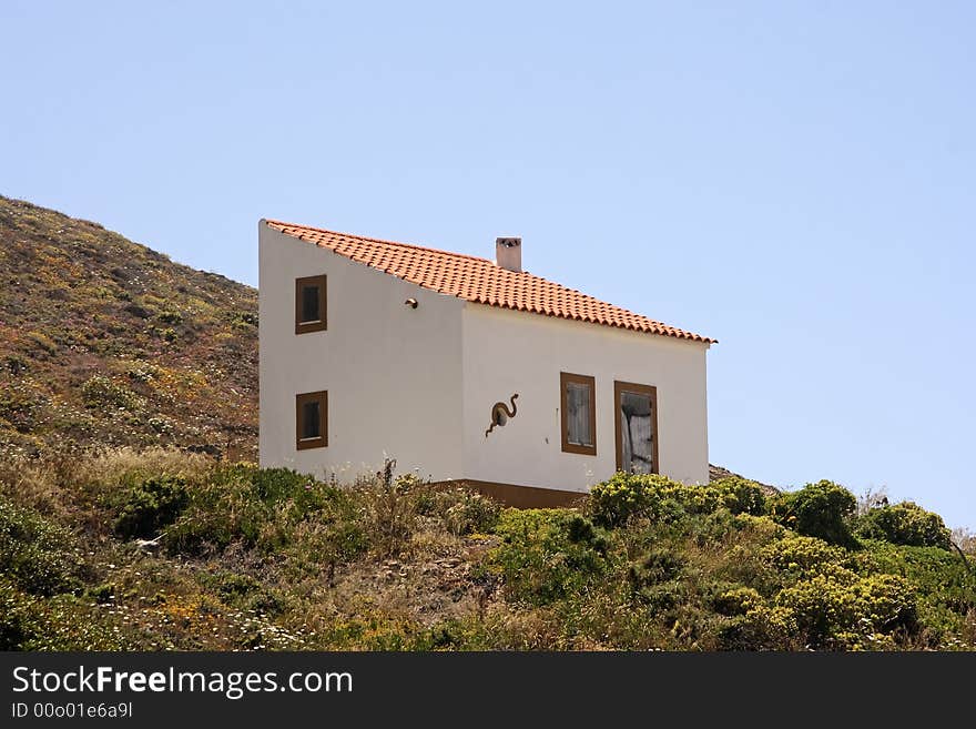 Lonely house on the hill near the ocean in Portugal. Lonely house on the hill near the ocean in Portugal