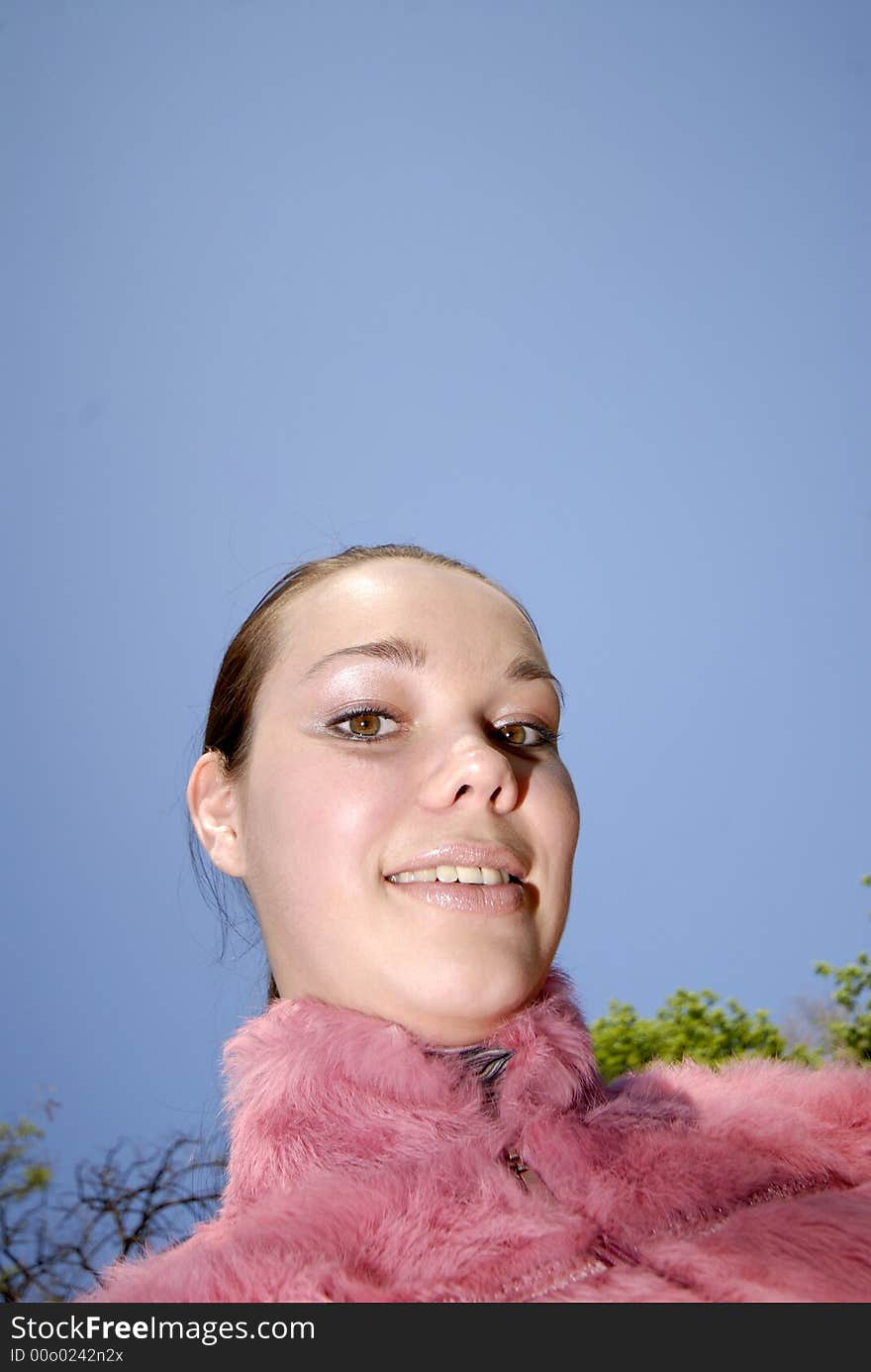 Portrait of  young girl on  background of  dark blue sky. Portrait of  young girl on  background of  dark blue sky