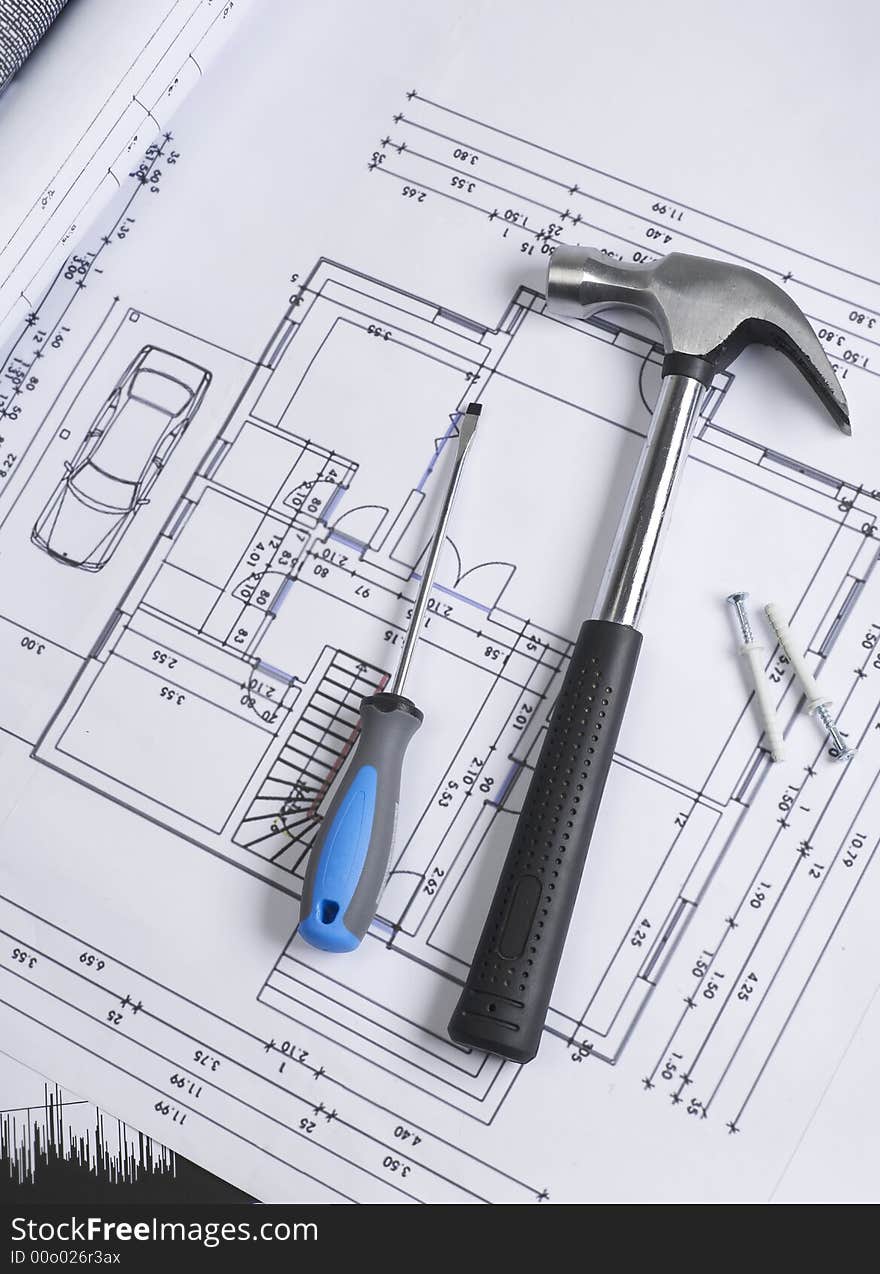 Hammer and screwdriver on blueprint. Hammer and screwdriver on blueprint