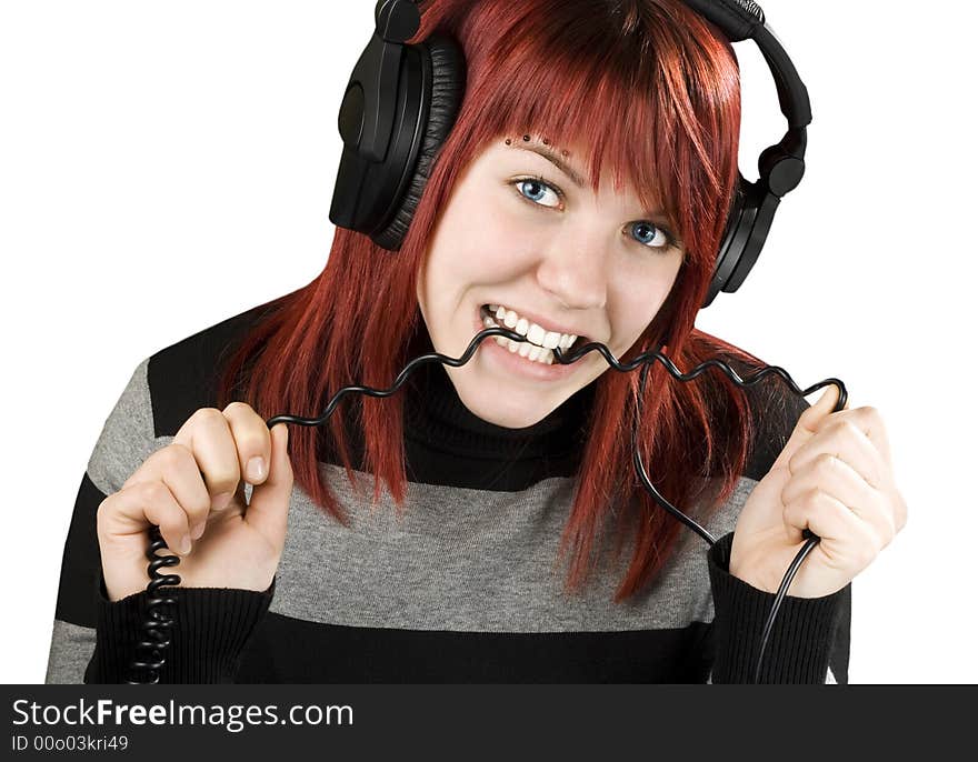 Girl biting headphone cable