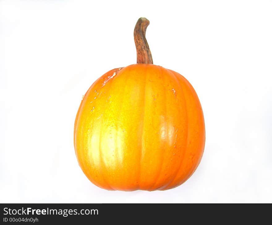 Isolated whole ripe orange pumpkin macro close-up. Isolated whole ripe orange pumpkin macro close-up