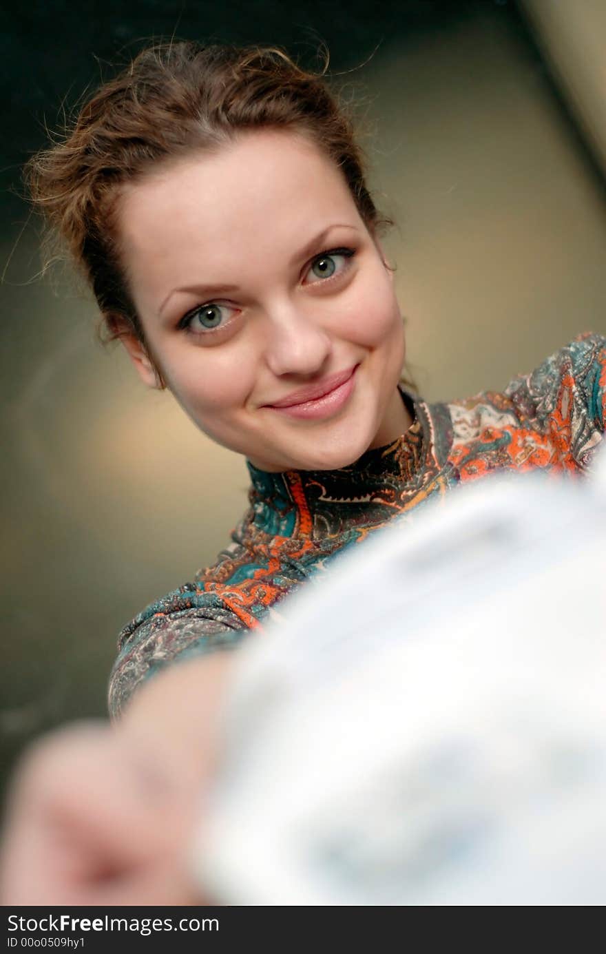 Portrait of young woman with opened book in hands. Portrait of young woman with opened book in hands