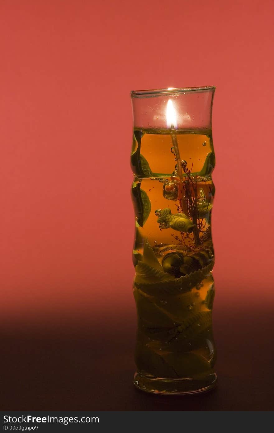 Oriental candle on red background