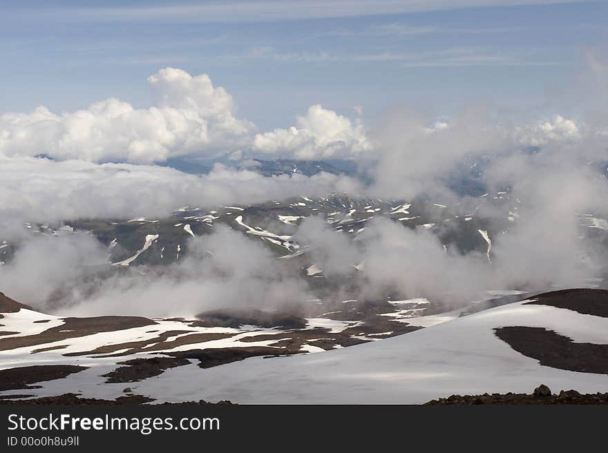 Mountain and clouds in the Kamchatka.  Russia