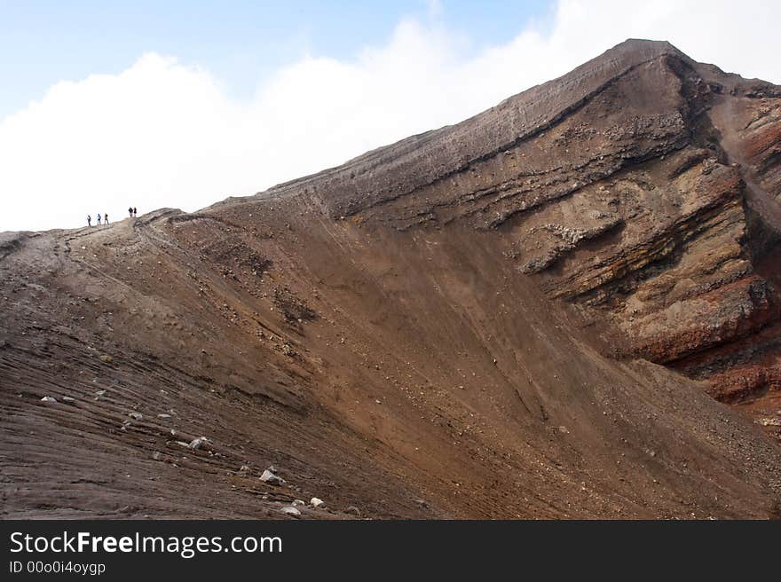 Tourists near Goreliy volcano. Kamchatka. Russia