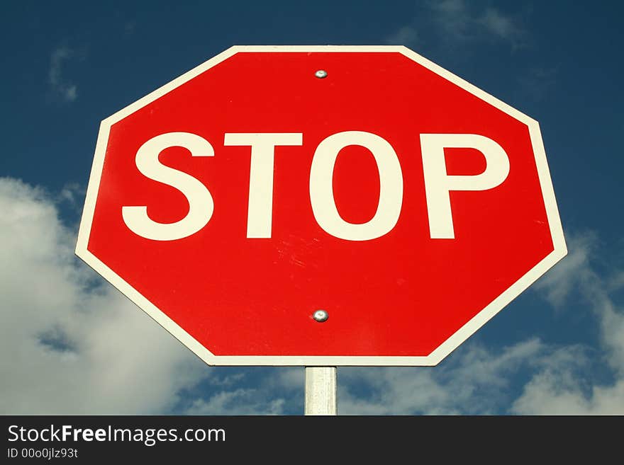 Imposing Stop Sign against Blue Sky