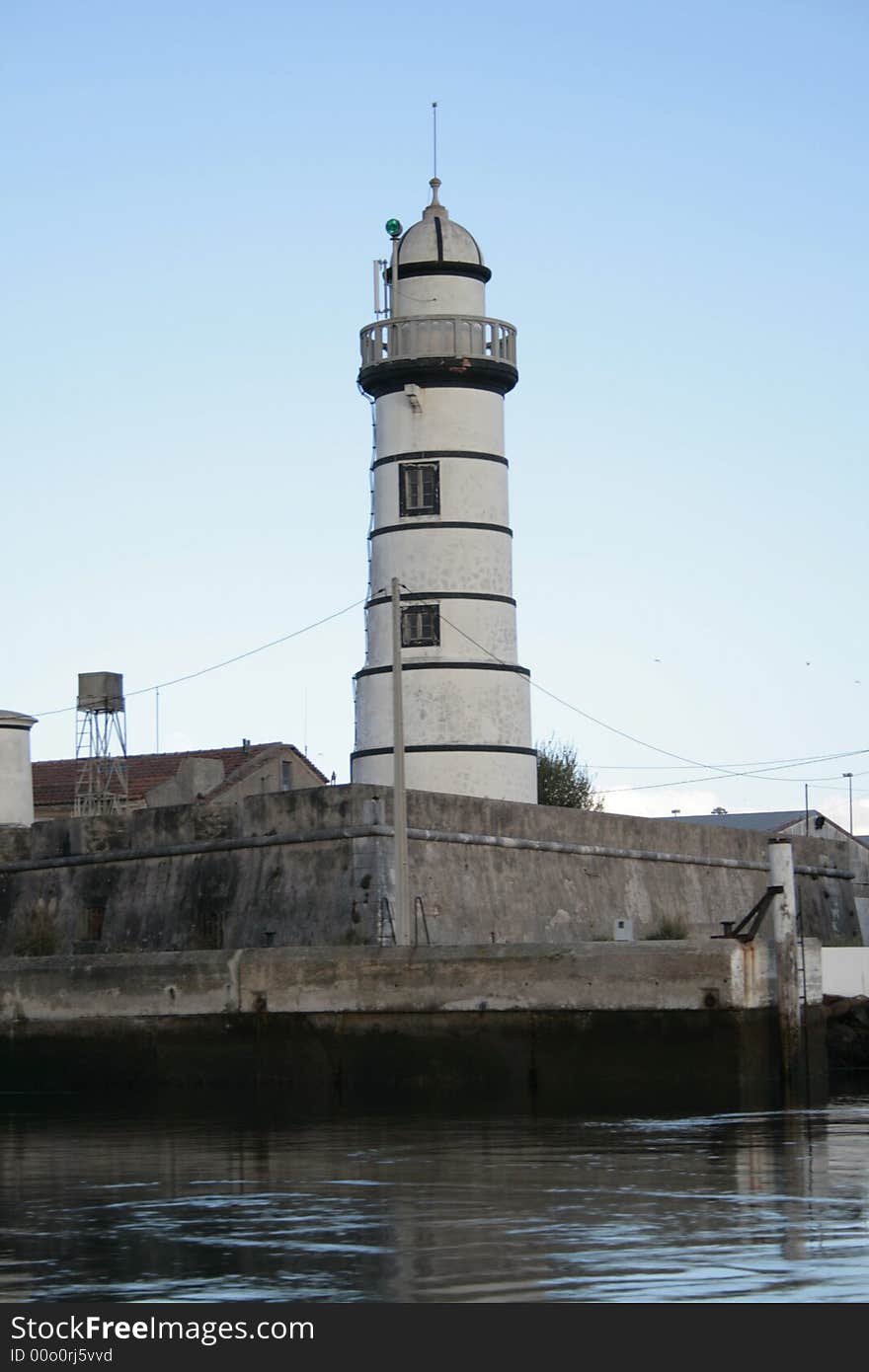 Lighthouse in front of the water. Lighthouse in front of the water