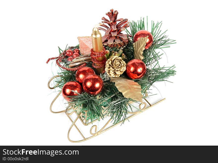 Santa's sledge with a candle and christmas ornaments. Santa's sledge with a candle and christmas ornaments