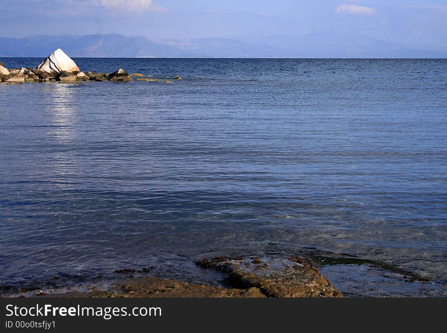 A view of the calm sea from the beach at teh daylight