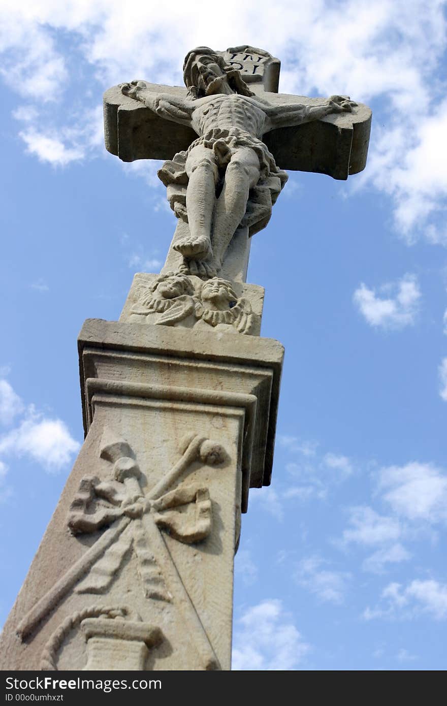 Old cross and blue sky