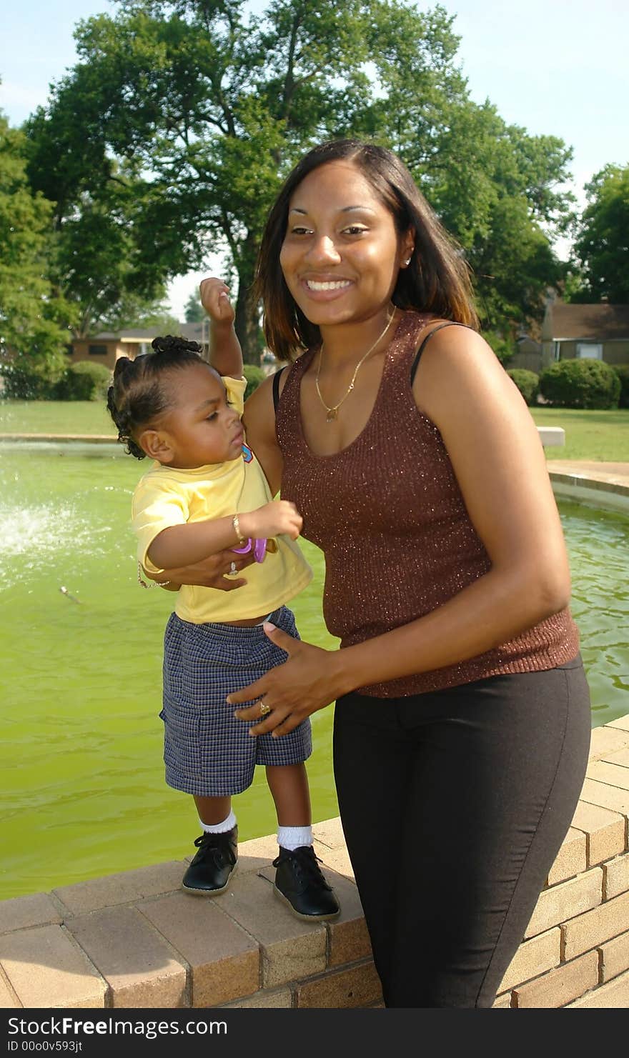 A picture of a happy mother and child with outdoor background