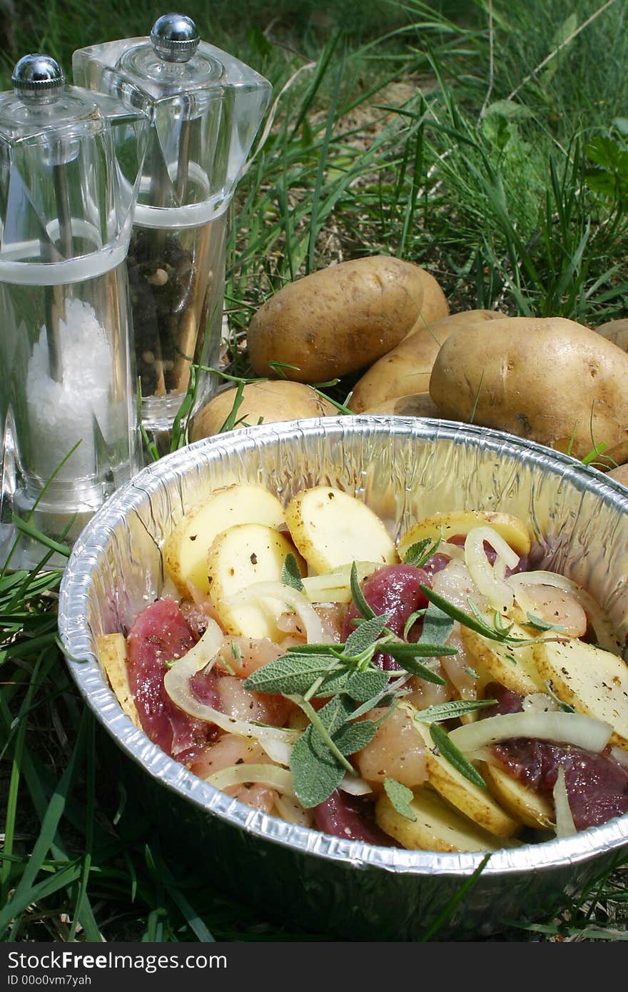 Meat and potatoes on the grill. Meat and potatoes on the grill