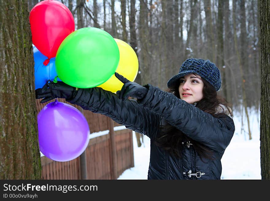 A girl pointind on the  ballon. A girl pointind on the  ballon