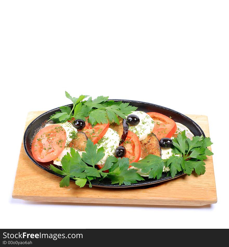 A portion of fresh greek salad on white background. A portion of fresh greek salad on white background