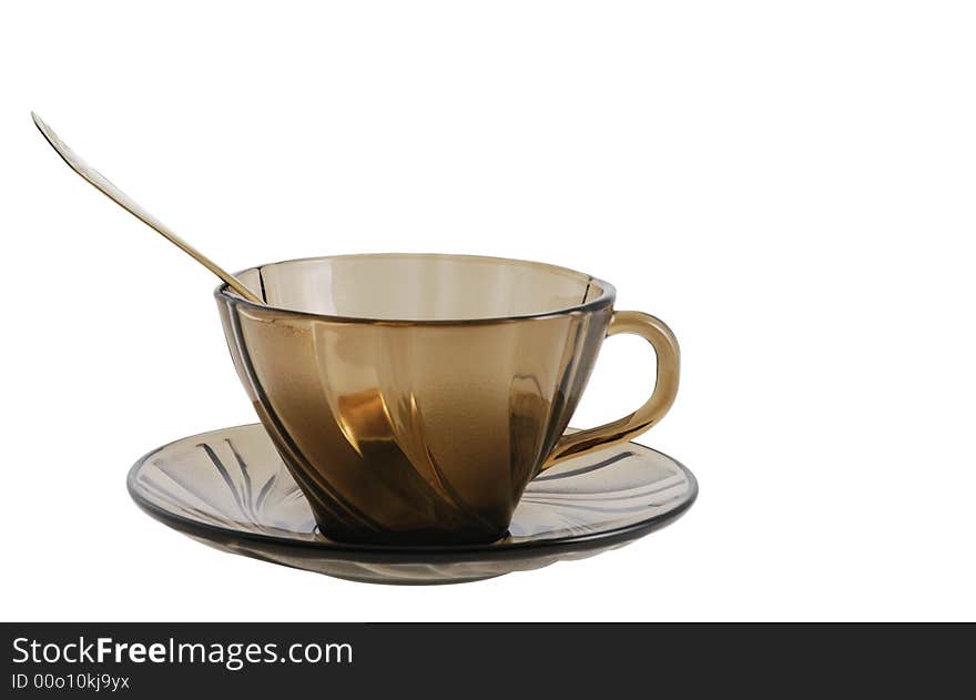 Glass tea or coffee cup with spoon