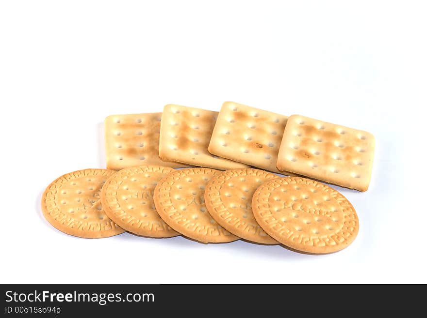 Round and square cookies on white background