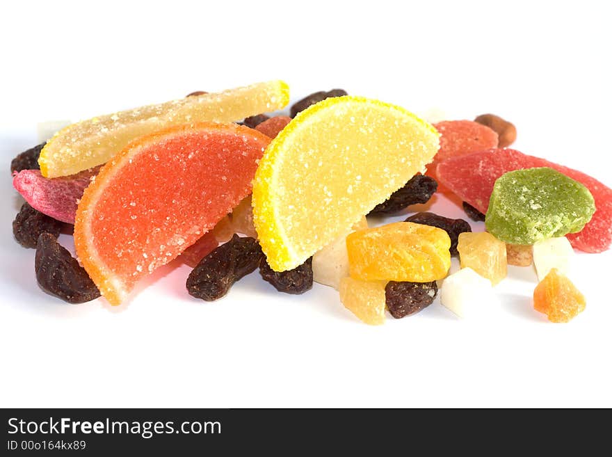 Dried fruits, raisins, candies and nuts on white backgroud. Dried fruits, raisins, candies and nuts on white backgroud