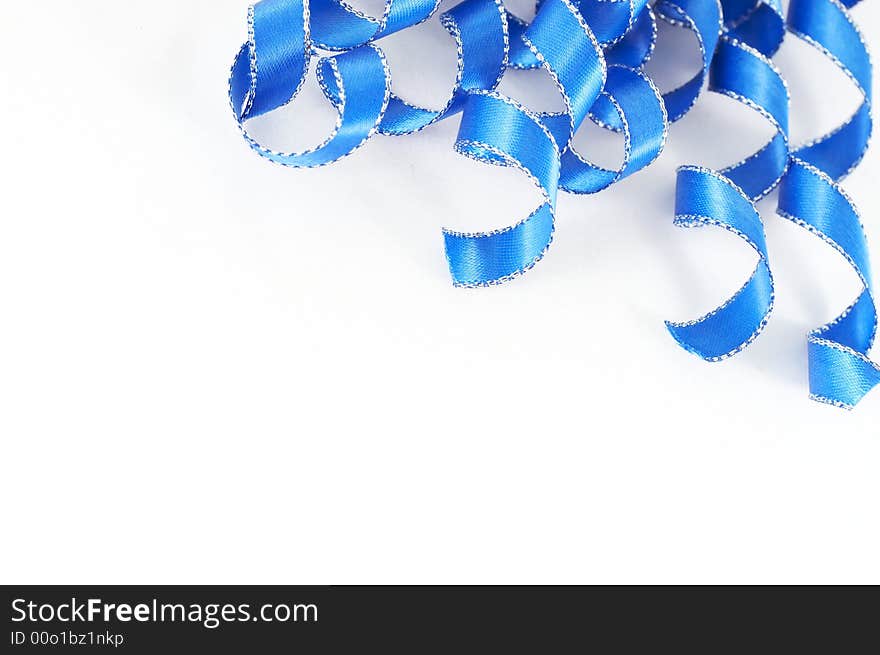 Macro of blue ribbon on white background. Macro of blue ribbon on white background