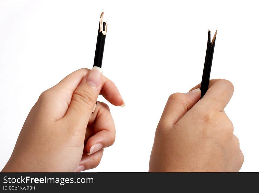 Hands trying to break a pencil over a white background. Hands trying to break a pencil over a white background