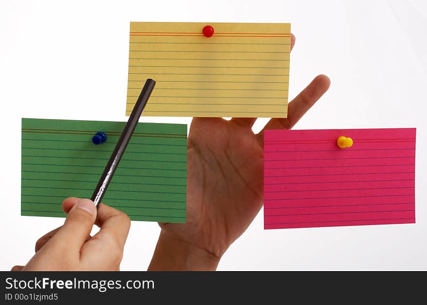 Three blank cards pinned on a hand