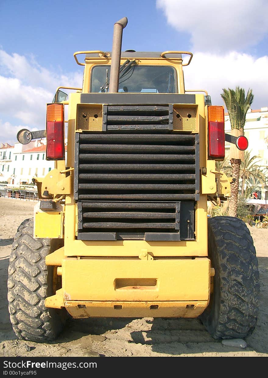 An orange digger on the beach