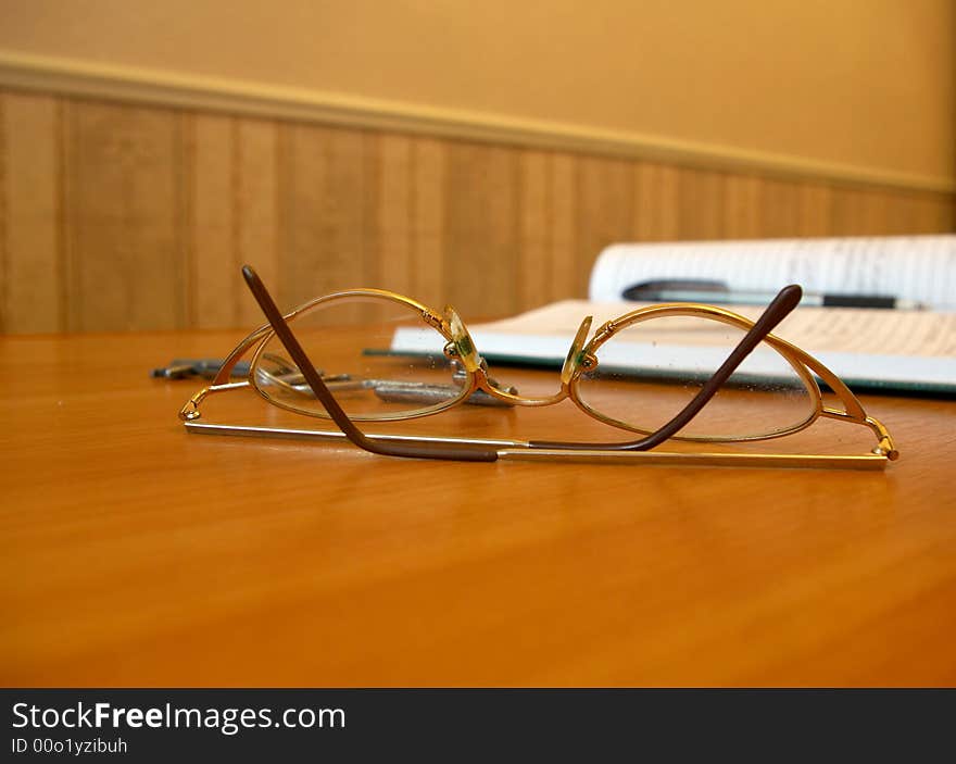 The combined glasses lay on a table. The combined glasses lay on a table