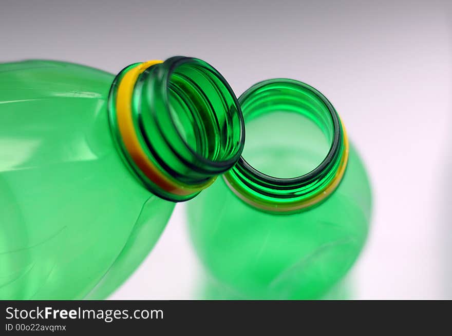 Plastic bottles, shallow DOF, focus on the top of the bottle