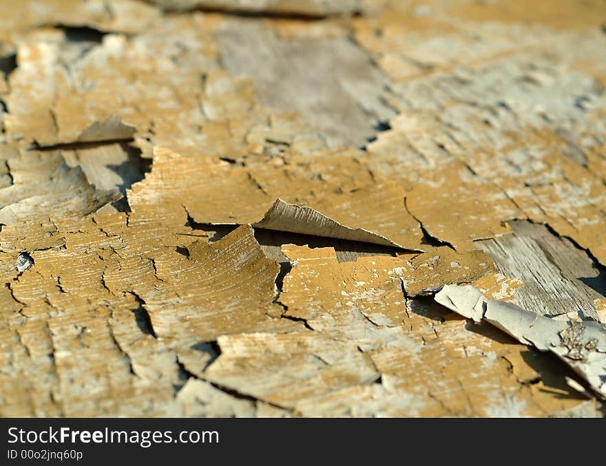 Cracked paint on an old wooden timber. Cracked paint on an old wooden timber