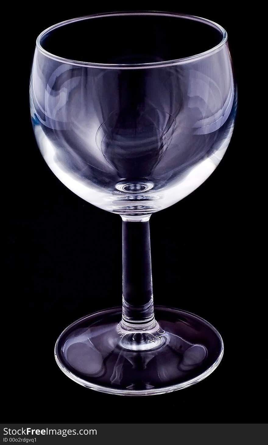 Empty wineglass on black background