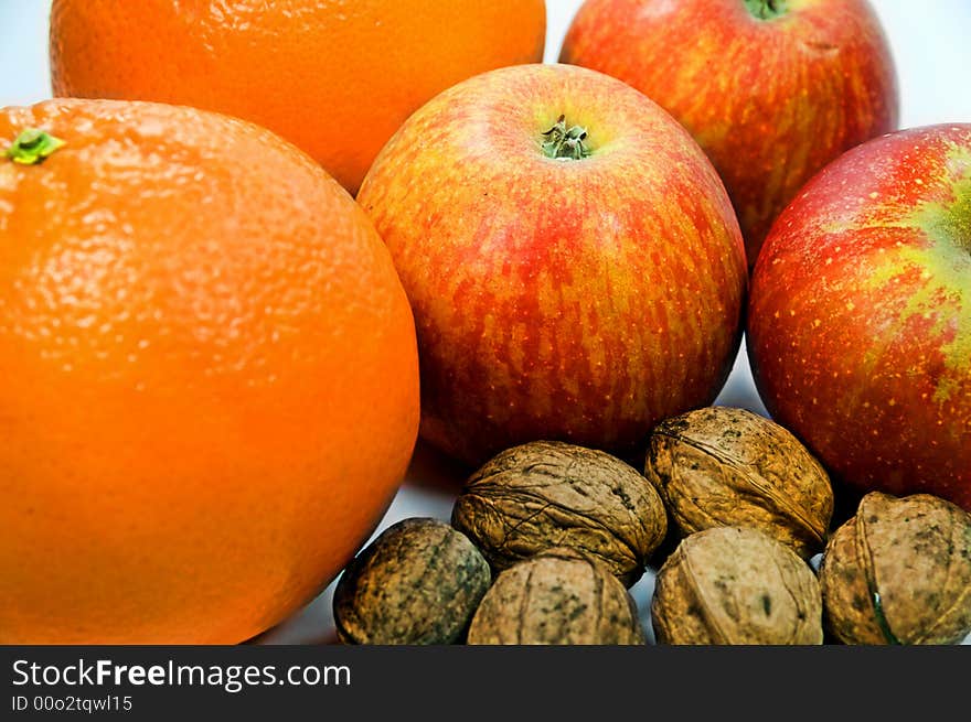 Apples, Walnuts and Oranges on white background