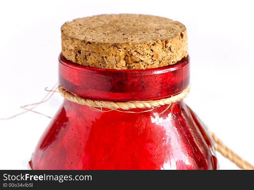 A beautiful red bottle with a cork cap. A beautiful red bottle with a cork cap