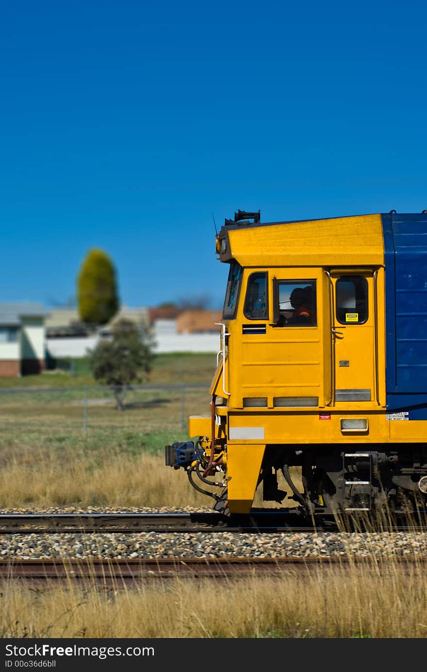 Freight Train Passing through a Residential Area